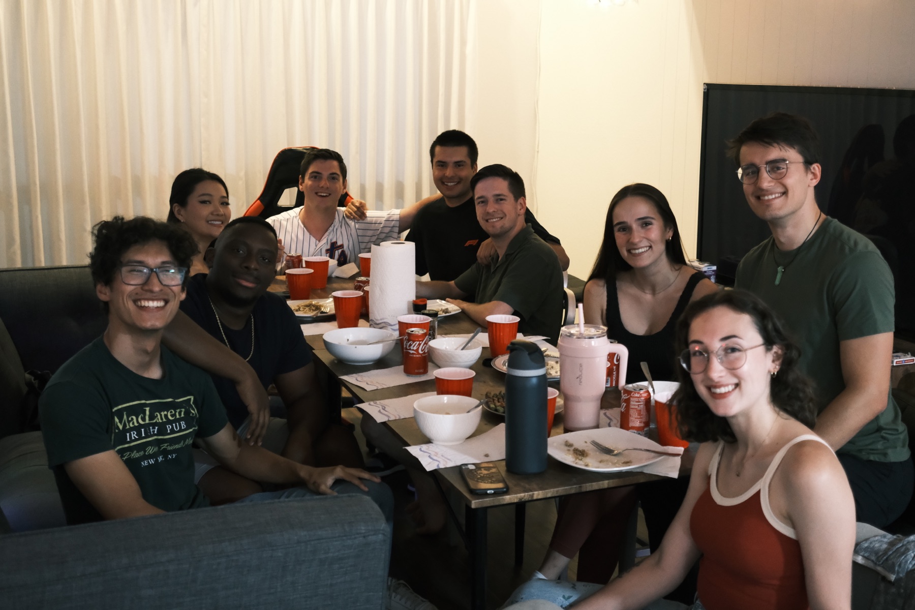 Self-Improvement Club members gathered around a table after a potluck meal