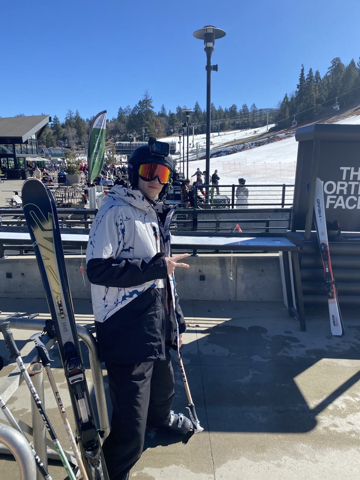 A Ski Trip participant ready for the mountain with skis and poles